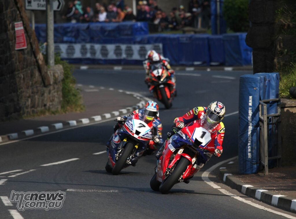 Josh Brookes chasing John McGuinness in the final Superbike race at the NW200
