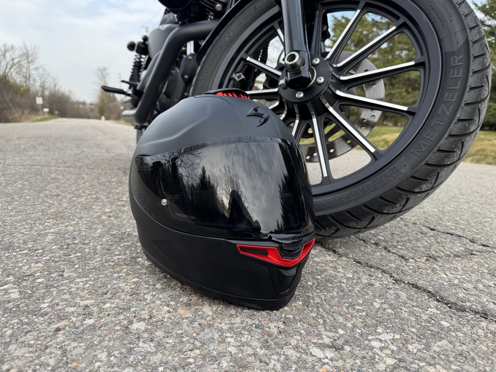 Scorpion EXO-Eclipse resting next to a motorcycle tire