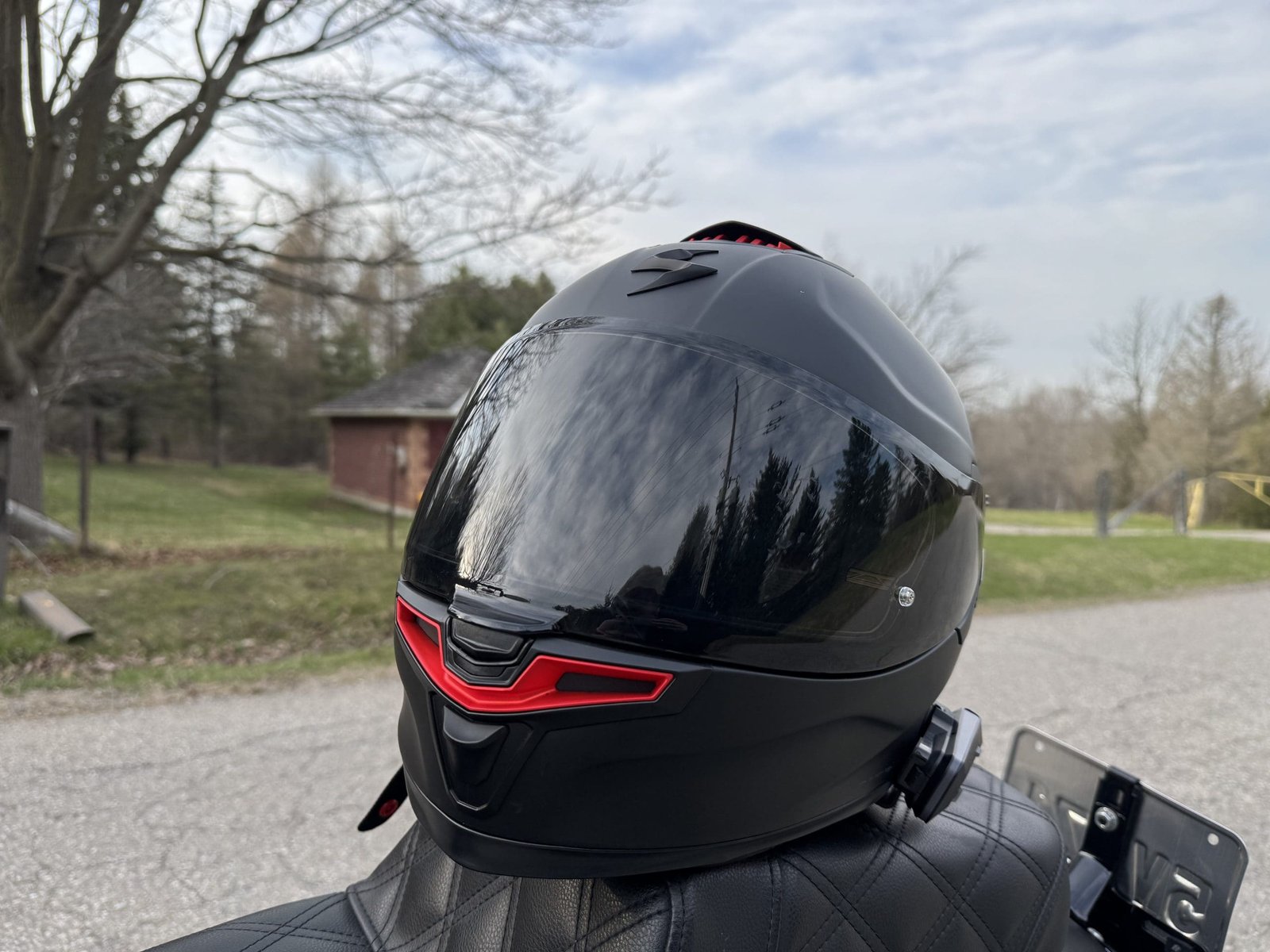 Scorpion EXO-Eclipse Helmet resting on a motorcycle seat