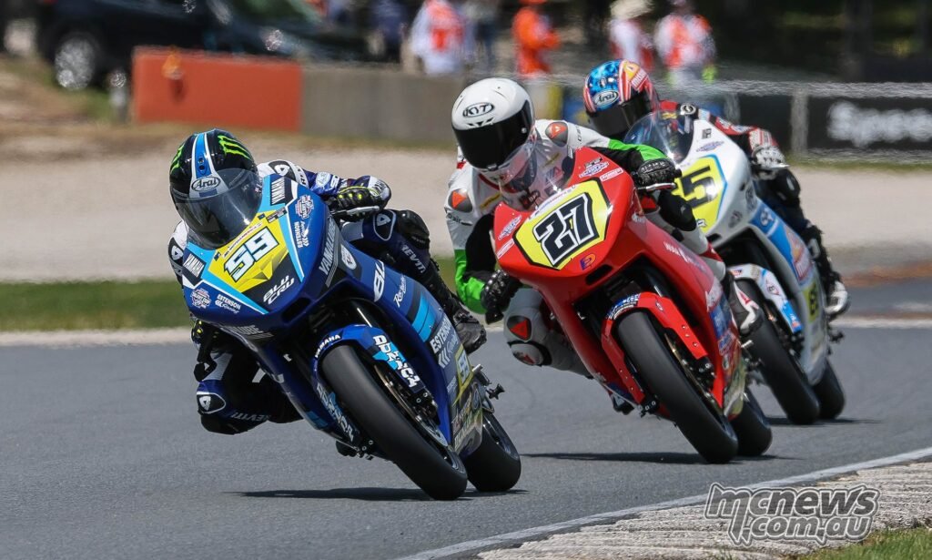 Sam Drane (59) leads Alessandro Di Mario (27) and Brodie Paige 65) en route to winning his first-career Talent Cup race at Road America. Photo by Brian J. Nelson