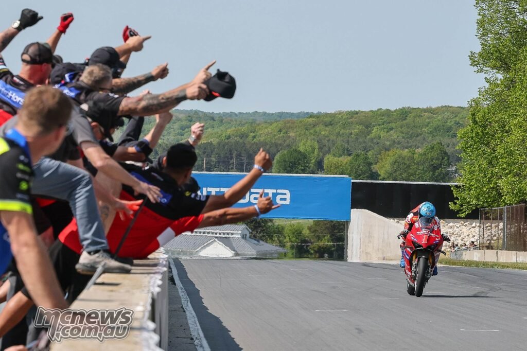 Herrin heads to the finish line with his second win of the weekend at Road America much to the joy of his Ducati crew. Photo by Brian J. Nelson