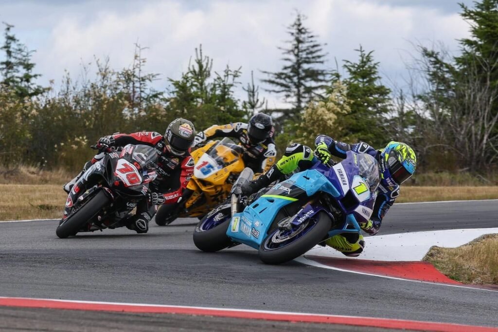 Mathew Scholtz (1) came out on top of a battle with Tyler Scott (70) and PJ Jacobsen (15) in Supersport action at Ridge Motorsports Park on Saturday. Photo by Brian J. Nelson