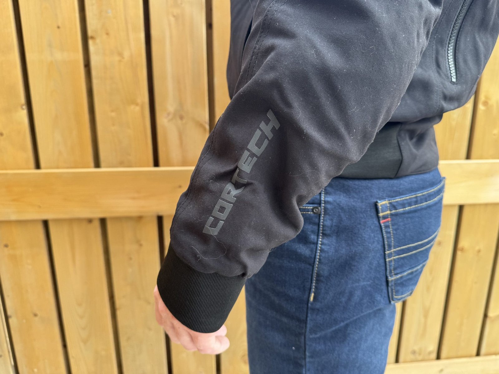 Cortech reflective logo on the sleeve of the Versa-Flo Jacket