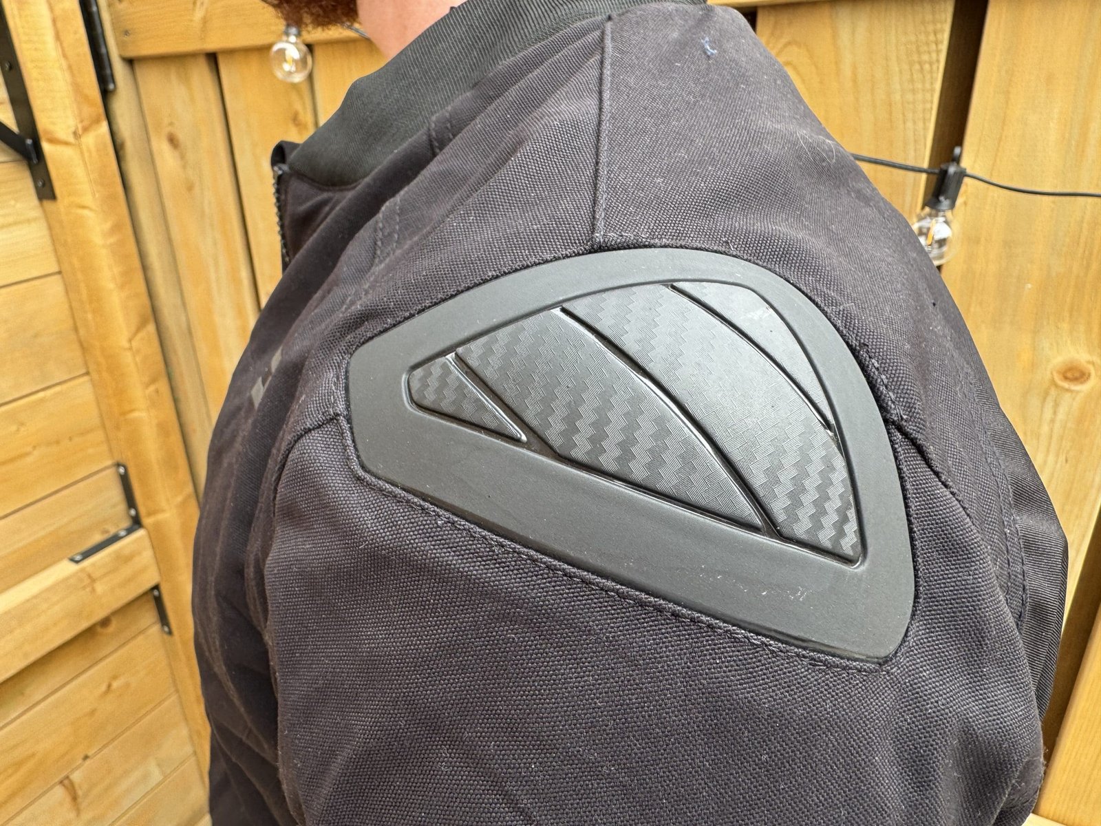 Close up photo of the shoulder slider on the Versa-Flo Jacket