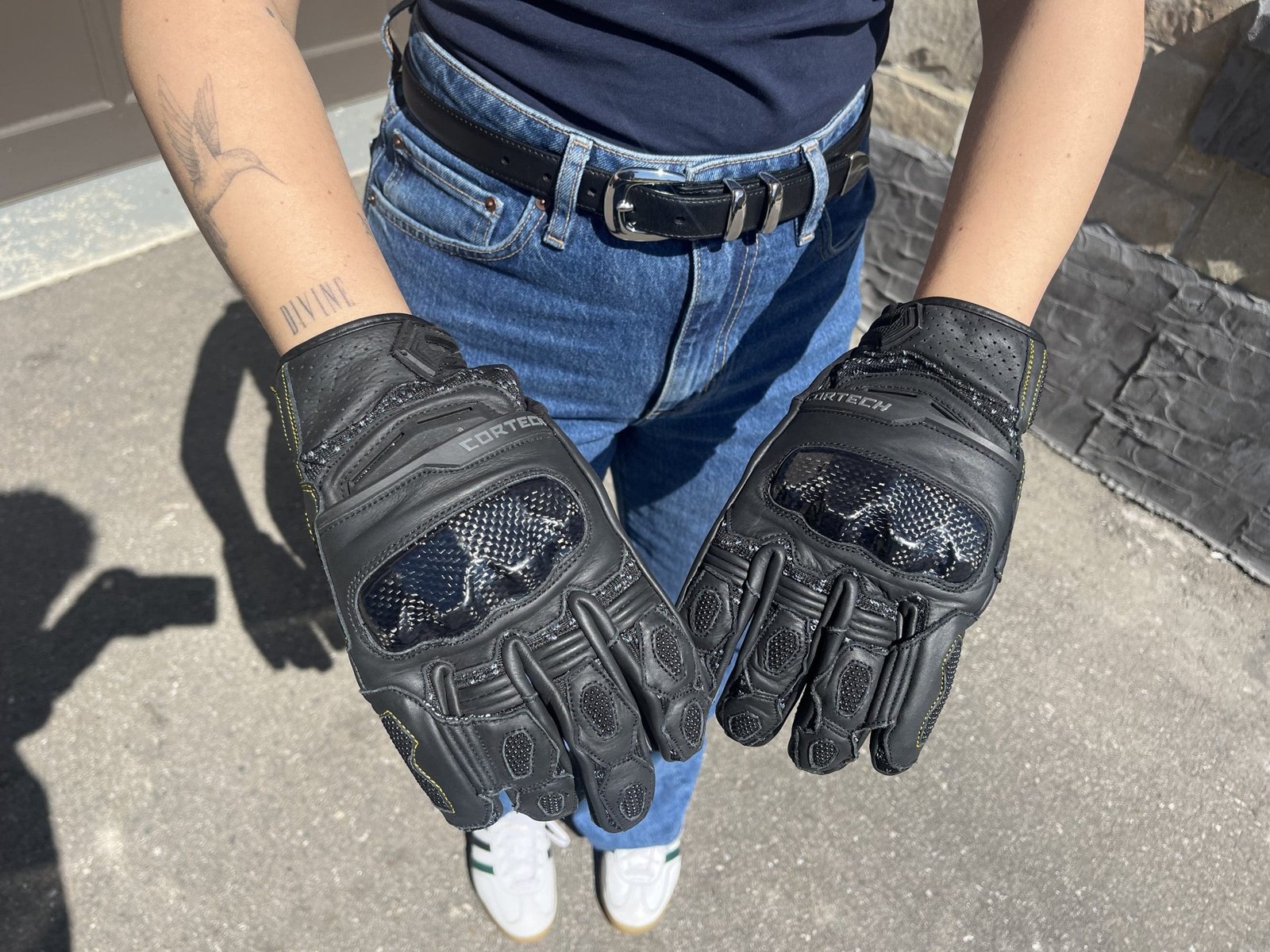motorcycle girl showing off The Cortech Revo ST V2 Gloves