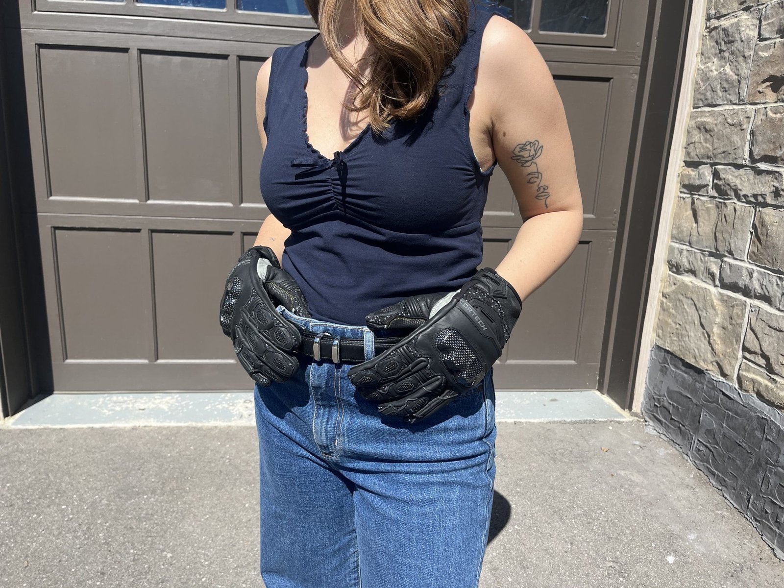 motorcycle girl showing off The Cortech Revo ST V2 Gloves