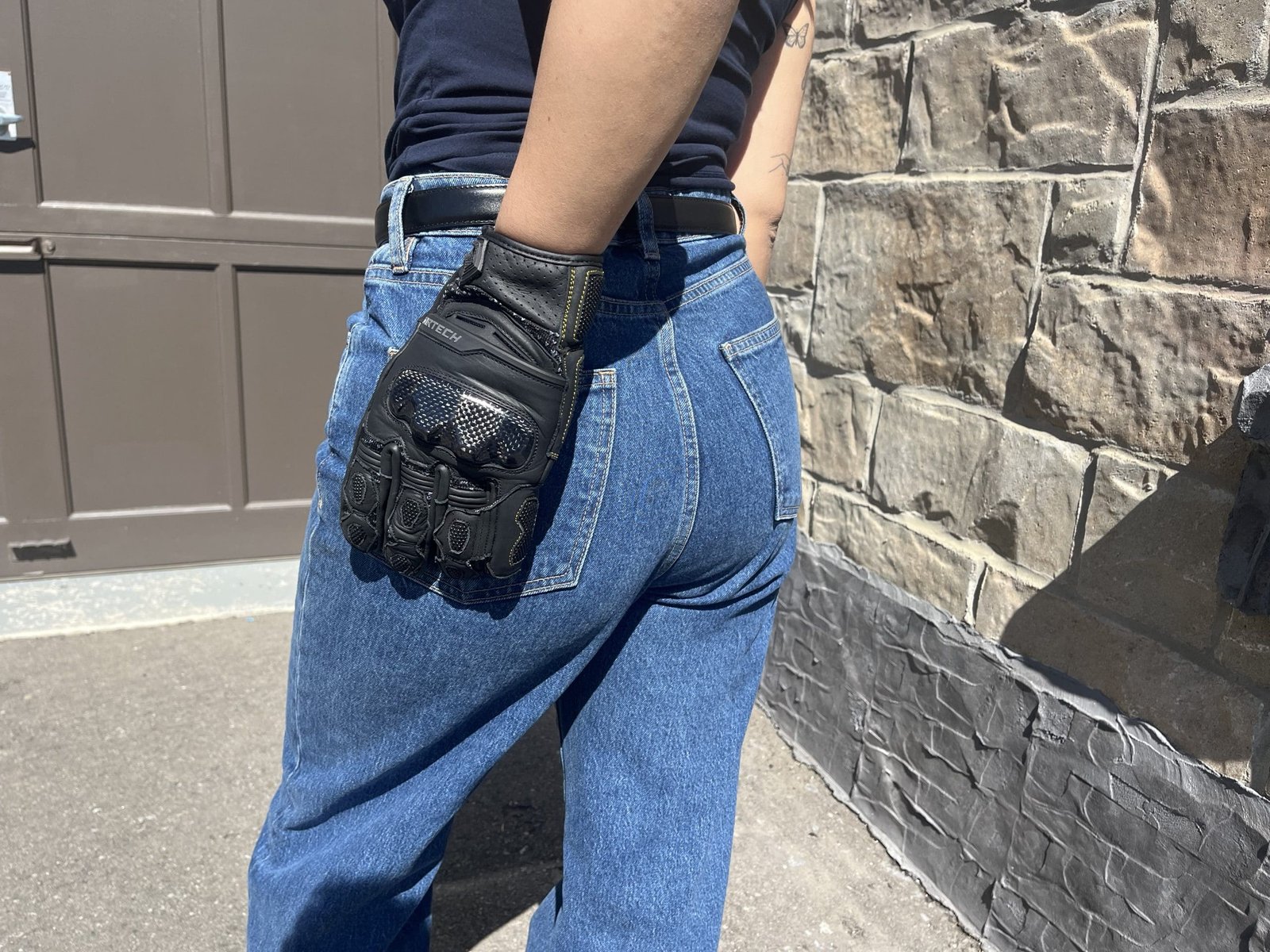 motorcycle girl showing off The Cortech Revo ST V2 Gloves