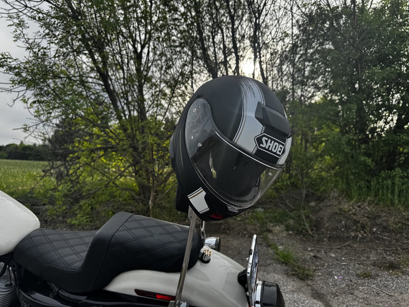 Shoei Neotec 3 Satori TC-5 Helmet on sissy bar of harley davidson sportster 883