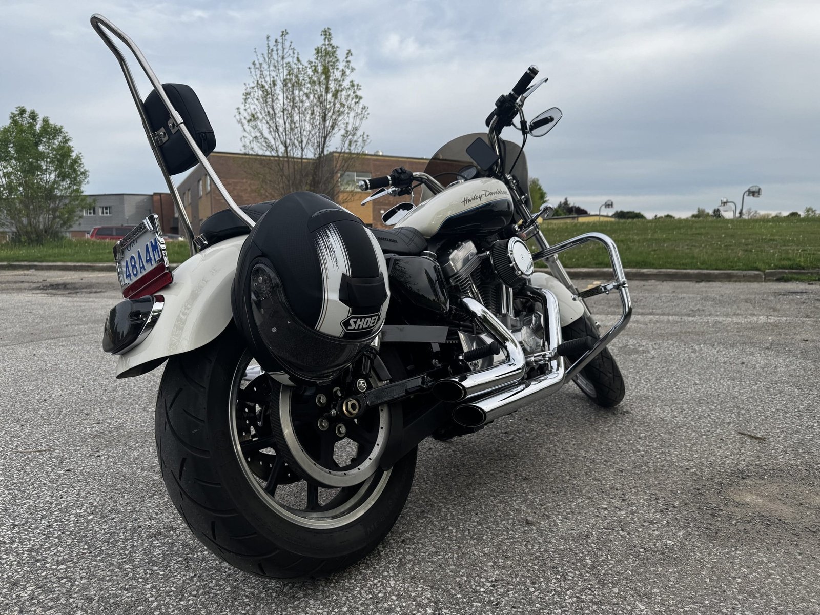 Shoei Neotec 3 Satori TC-5 Helmet hanging on harley davidson sportster 883 turn signal