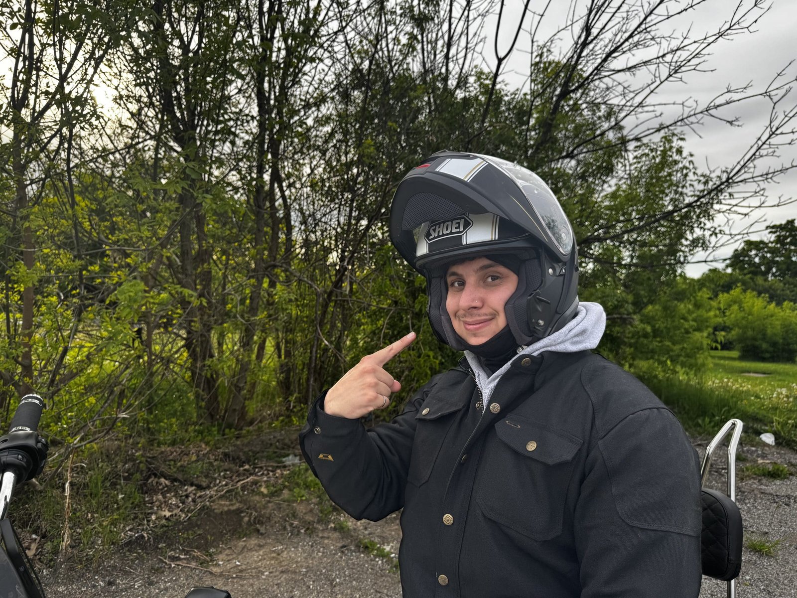 motorcycle rider showing of modular feature of Shoei Neotec 3 Satori TC-5 Helmet