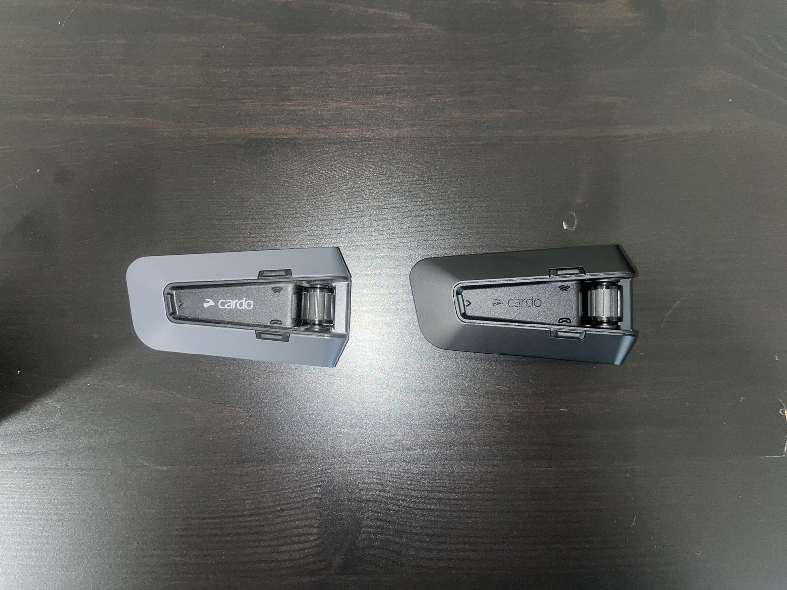 Cardo Packtalk Pro beside cardo packtalk edge