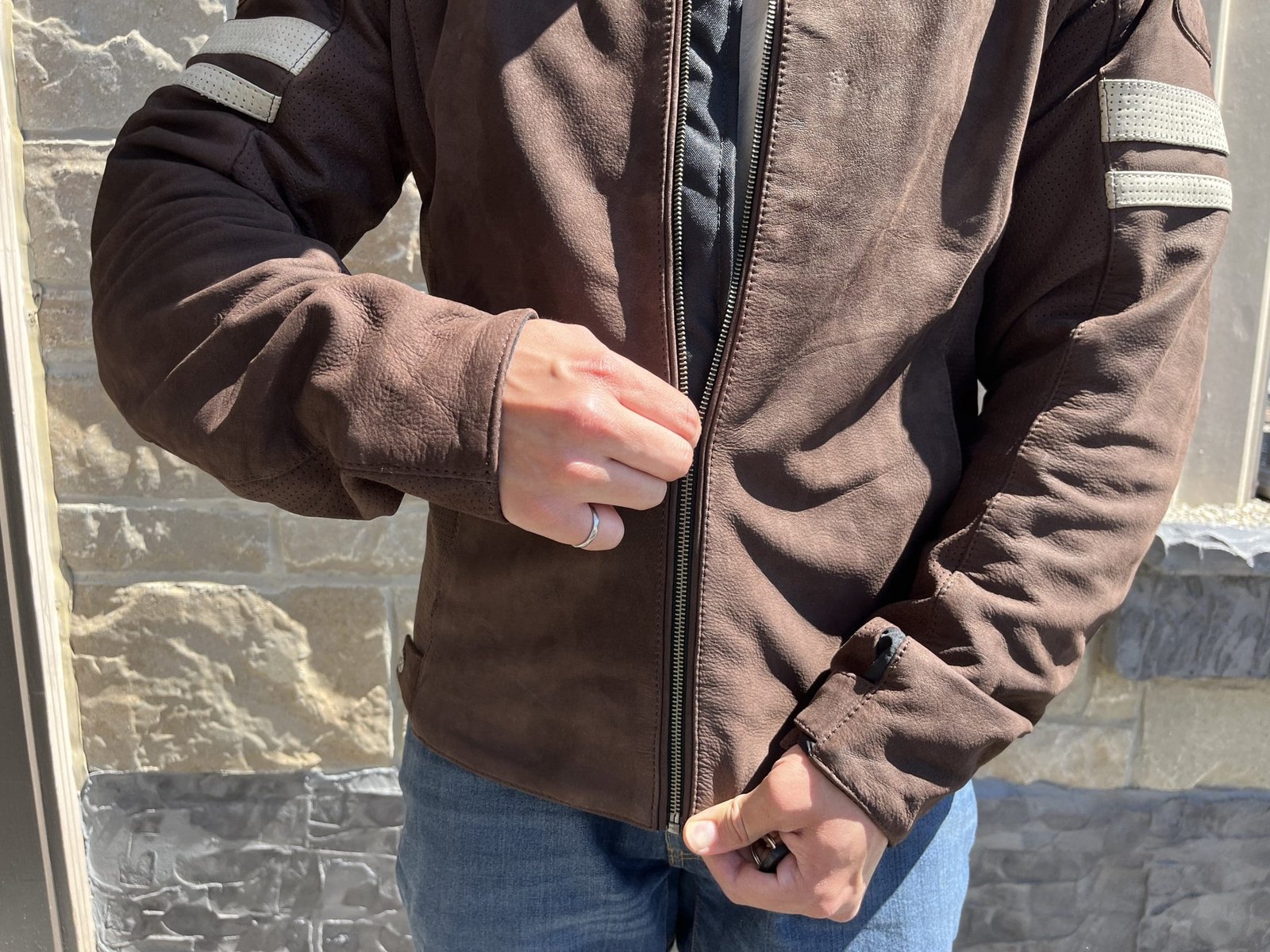 motorcycle rider zipping up Joe Rocket Classic 92 Leather Jacket