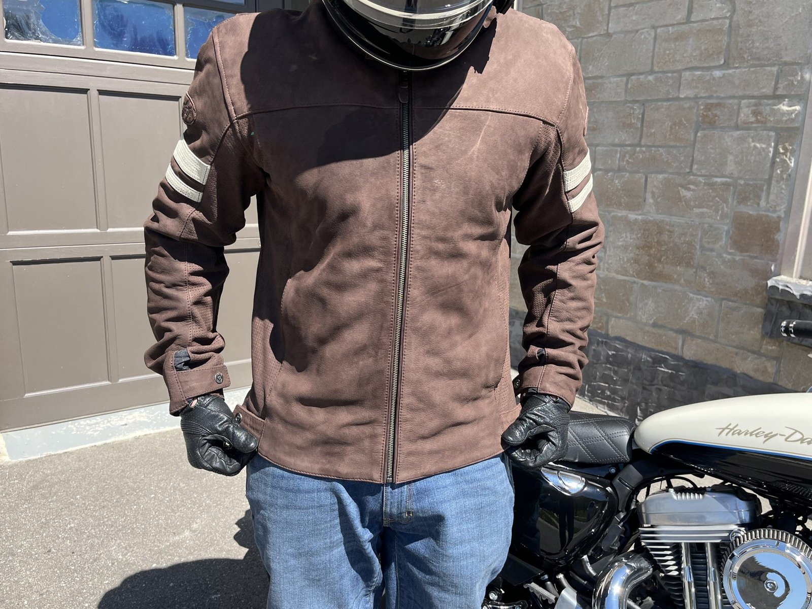 motorcycle rider adjusting fit of Joe Rocket Classic 92 Leather Jacket