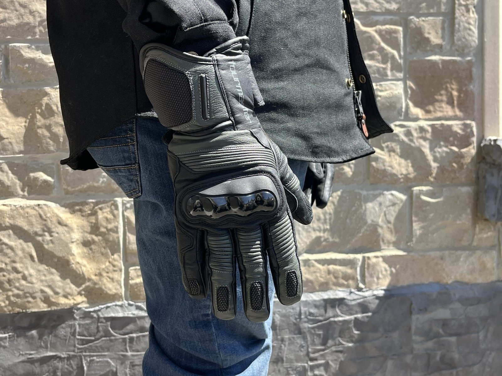 a motorcycle rider wearing the TOURMASTER Super Warm Waterproof Gloves
