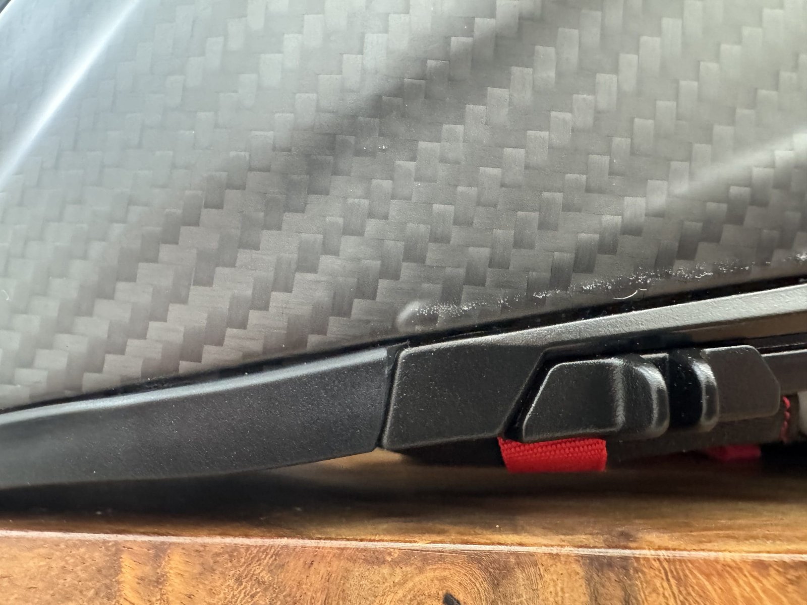 Small bubble in the carbon fiber wrap on the Voss 991 Carbon helmet