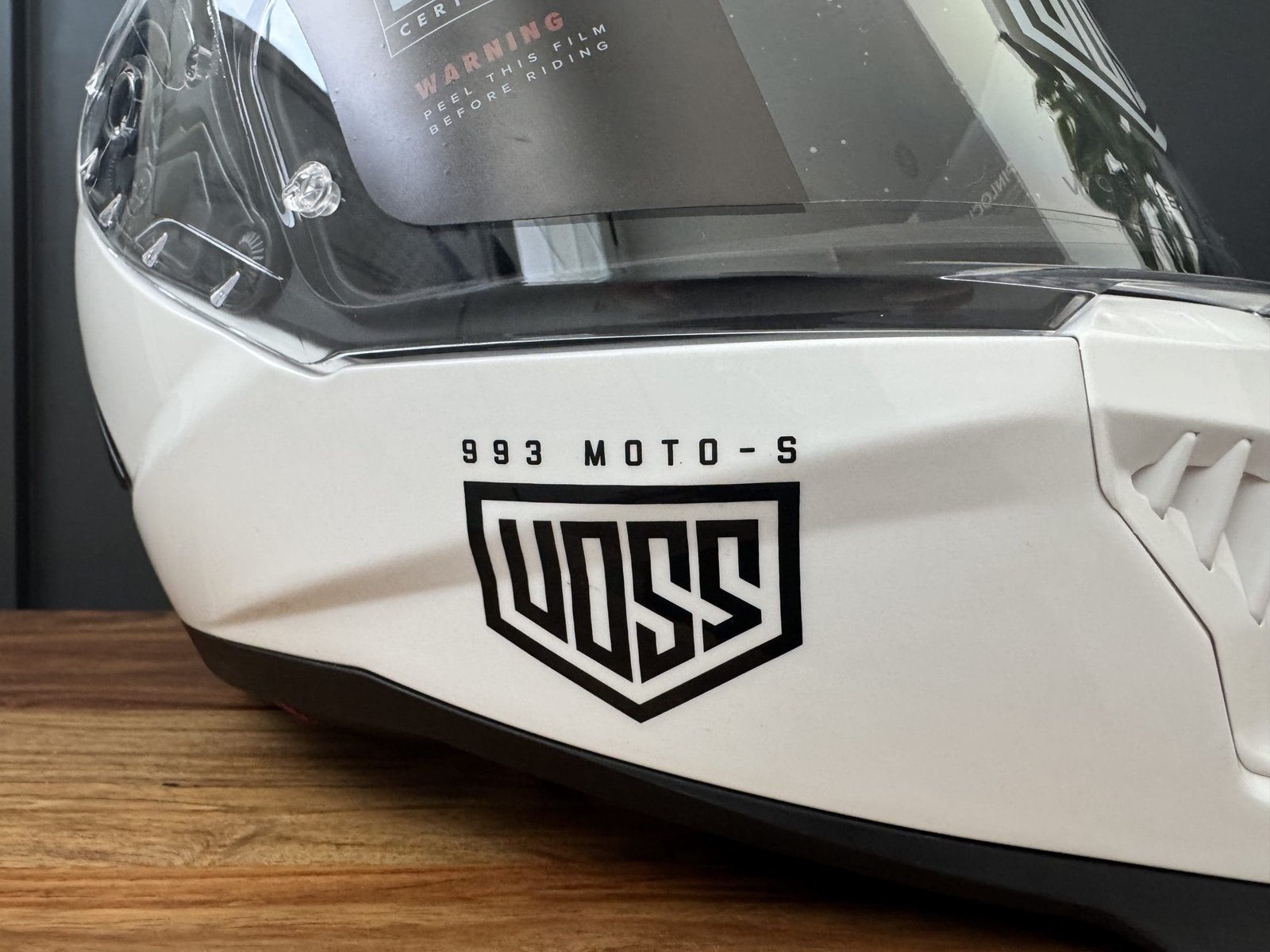 Close up photo of the Voss logo on the 993 Moto-S chinbar