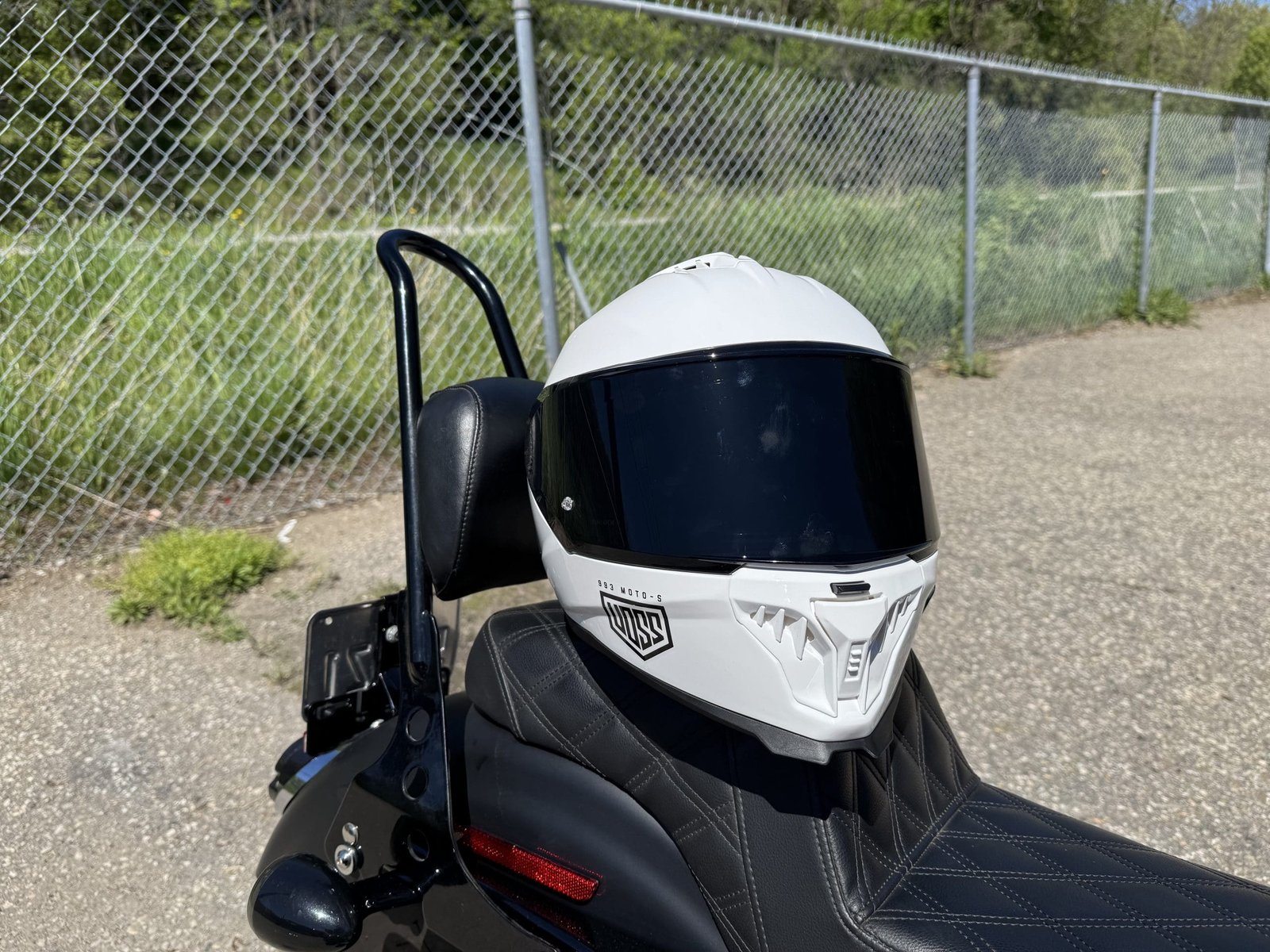 Voss 993 Moto-S resting on a Harley Davidson seat