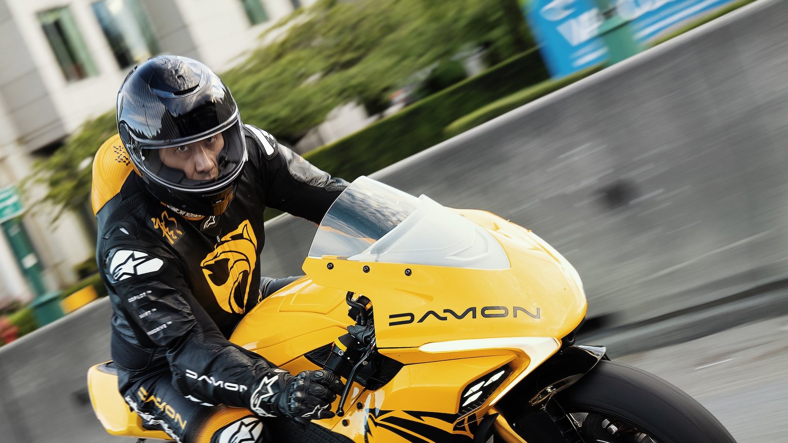 Dominique Kwong, CEO for Damon, on a HyperSport mtorcycle.