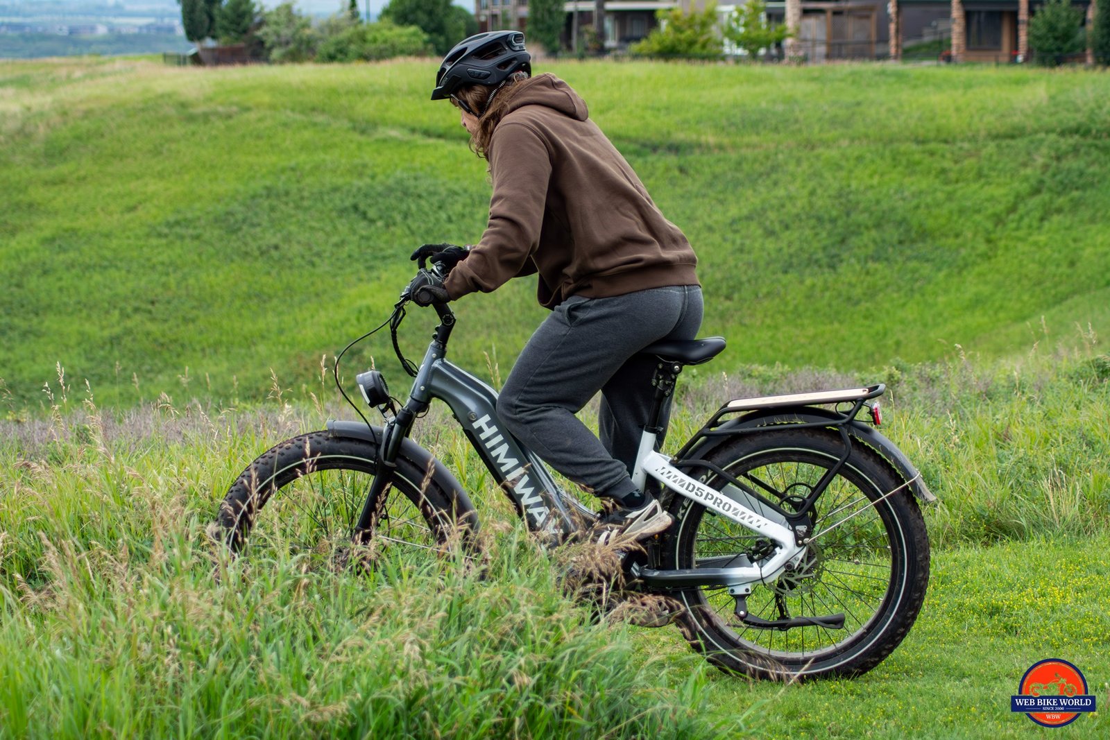 Brayden riding a Himiway D5 Pro in the grass