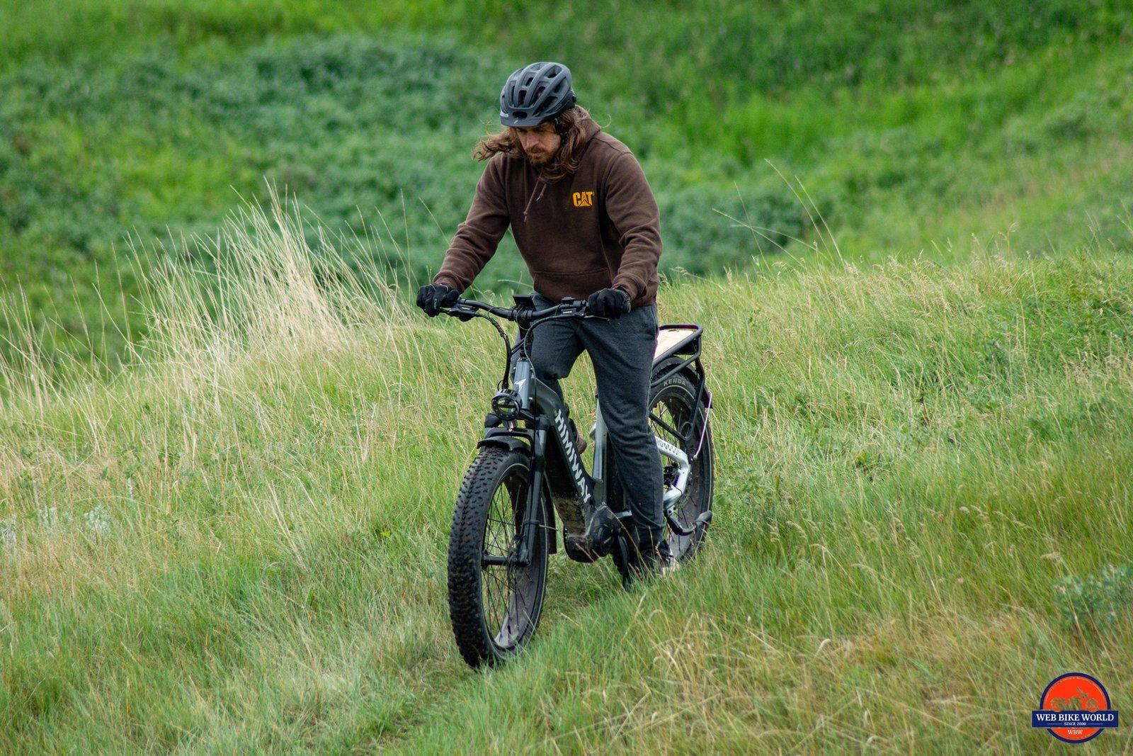 Brayden riding a Himiway D5 Pro in the grass