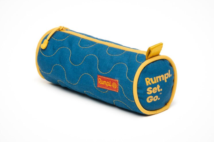 Rumpl's Deep Ember insulated camp blanket features an ember-resistant shell offering a layer of protection that traditional synthetic camping gear lacks.