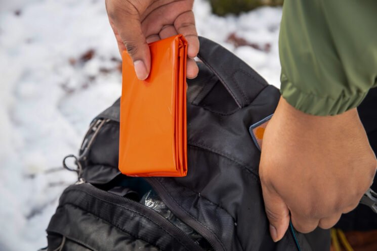 The SOL Emergency Blanket is a great backup for motorcycle campers who get stuck in an unplanned camping situation.