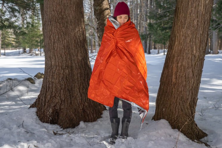 The SOL Emergency Blanket is a great backup for motorcycle campers who get stuck in an unplanned camping situation.