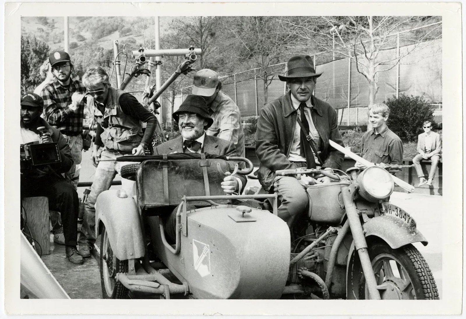 Harrison Ford ("Indiana Jones") and Sean Connery ("Professor Henry Walton Jones, Sr.") sitting on the Ural motorcycle kitted out for "Indiana Jones: The Last Crusade" (1989). Media sourced from Motorcycle.com.