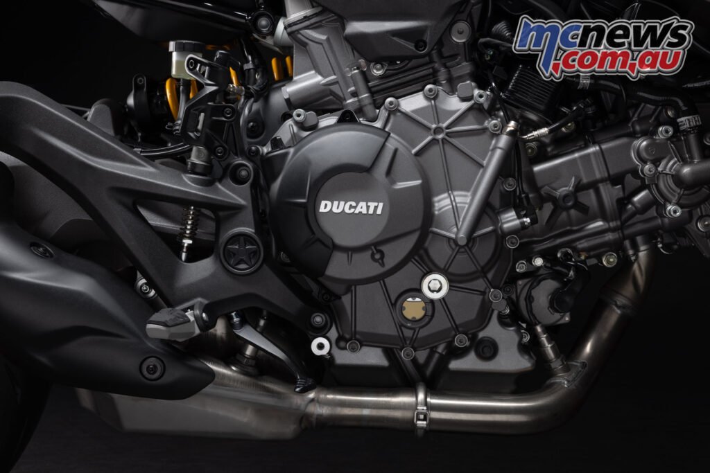 Close-up of the 2026 Ducati Monster V-twin engine with variable timing and lightweight structural mounting