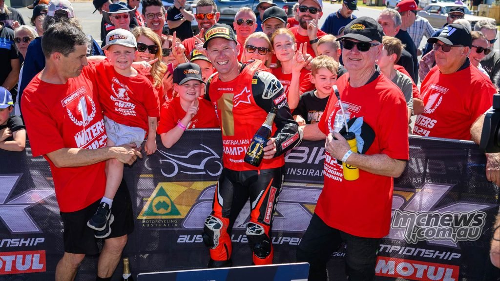 Josh Waters and the McMartin racing crew and family celebrating Josh's fourth championship in 2024