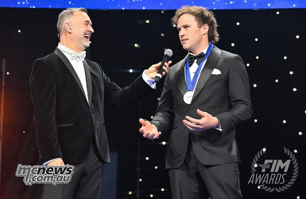 Close-up of Sanders receiving recognition for his 2025 World Rally-Raid Championship season.