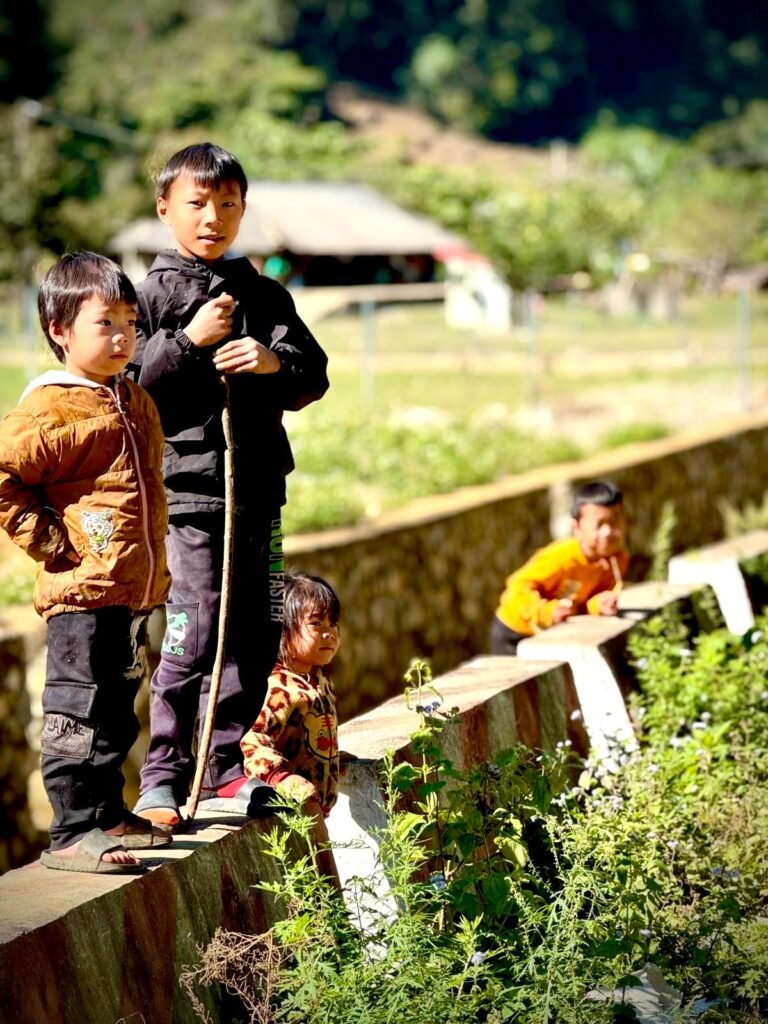 Kids in a remove Vietnamese village along our motorcycle tour route.