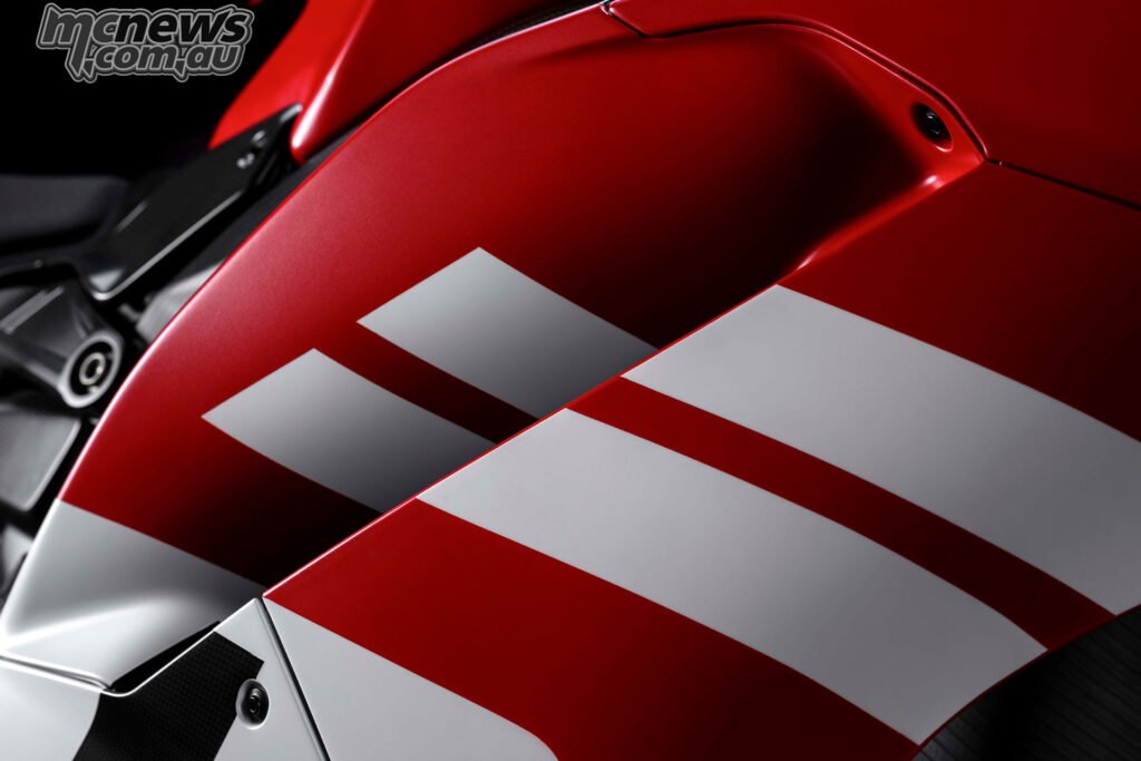 Close-up of Ducati Superleggera V4 Centenario Rosso Centenario fairing graphics and white stripes.