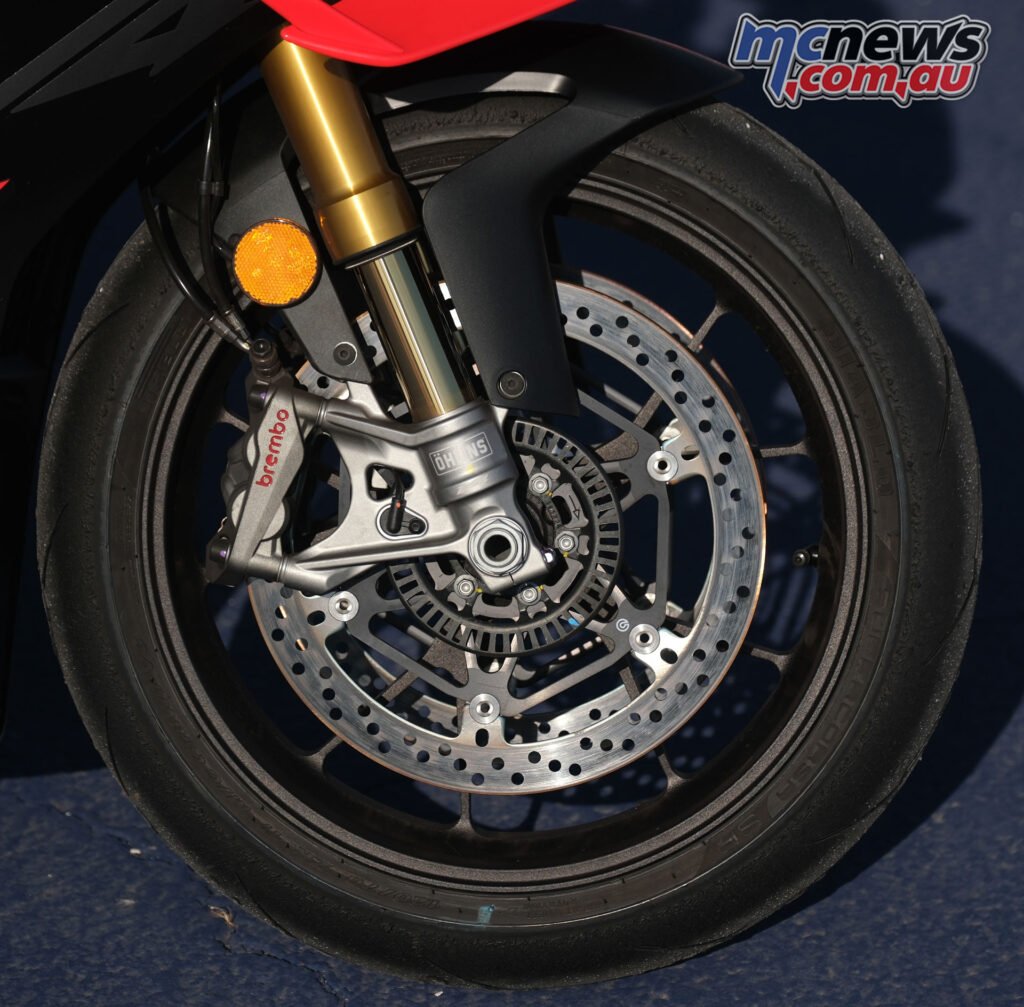 Close-up of the Aprilia RSV4 Factory 1100 forged front wheel and brake setup