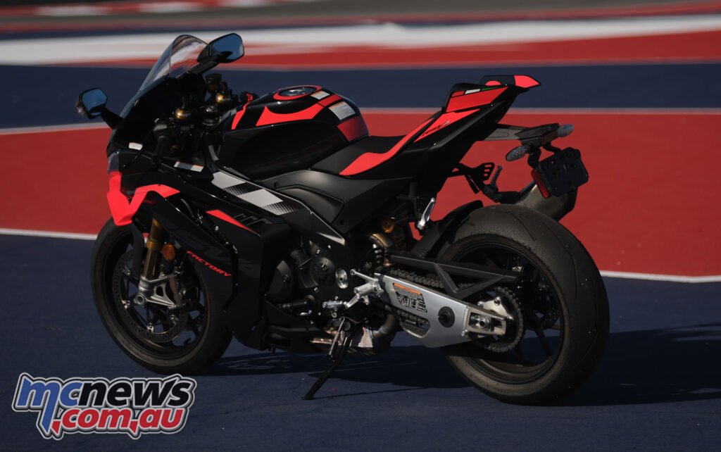 Rear three-quarter view of the 2026 Aprilia RSV4 Factory 1100 in pit lane